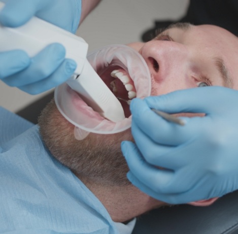 Man having digital dental impressions taken